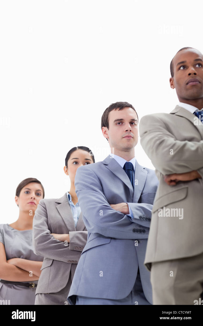 Close-up of a low-angle shot of colleagues crossing their arms in a single line Stock Photo