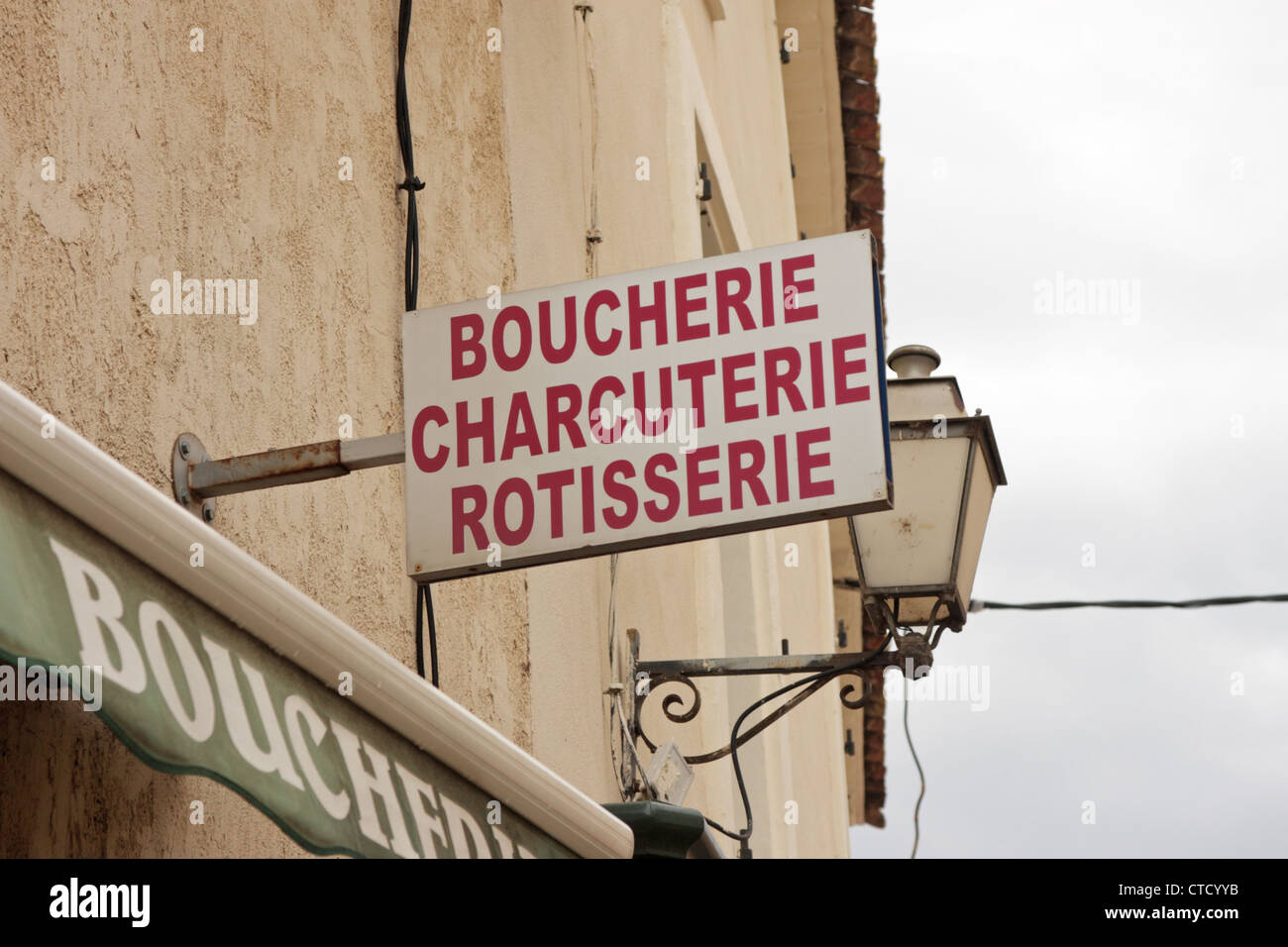 A Boucherie Charcuterie Rotisserie sign outside a butchers in the village of Gruissan Languedoc-Roussillon France Stock Photo