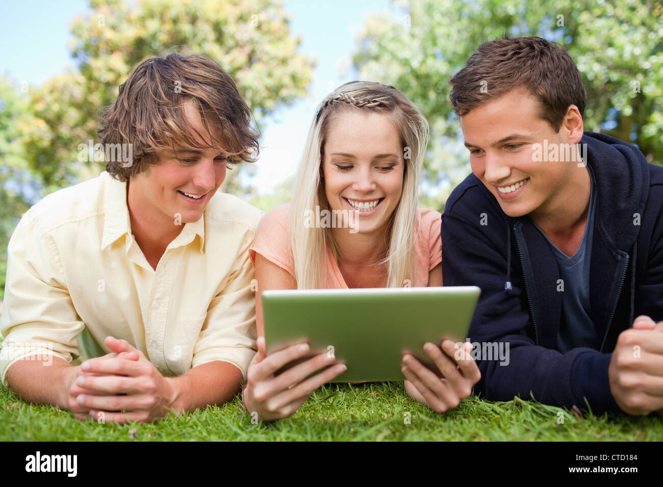 Three students using a tactile tablet Stock Photo