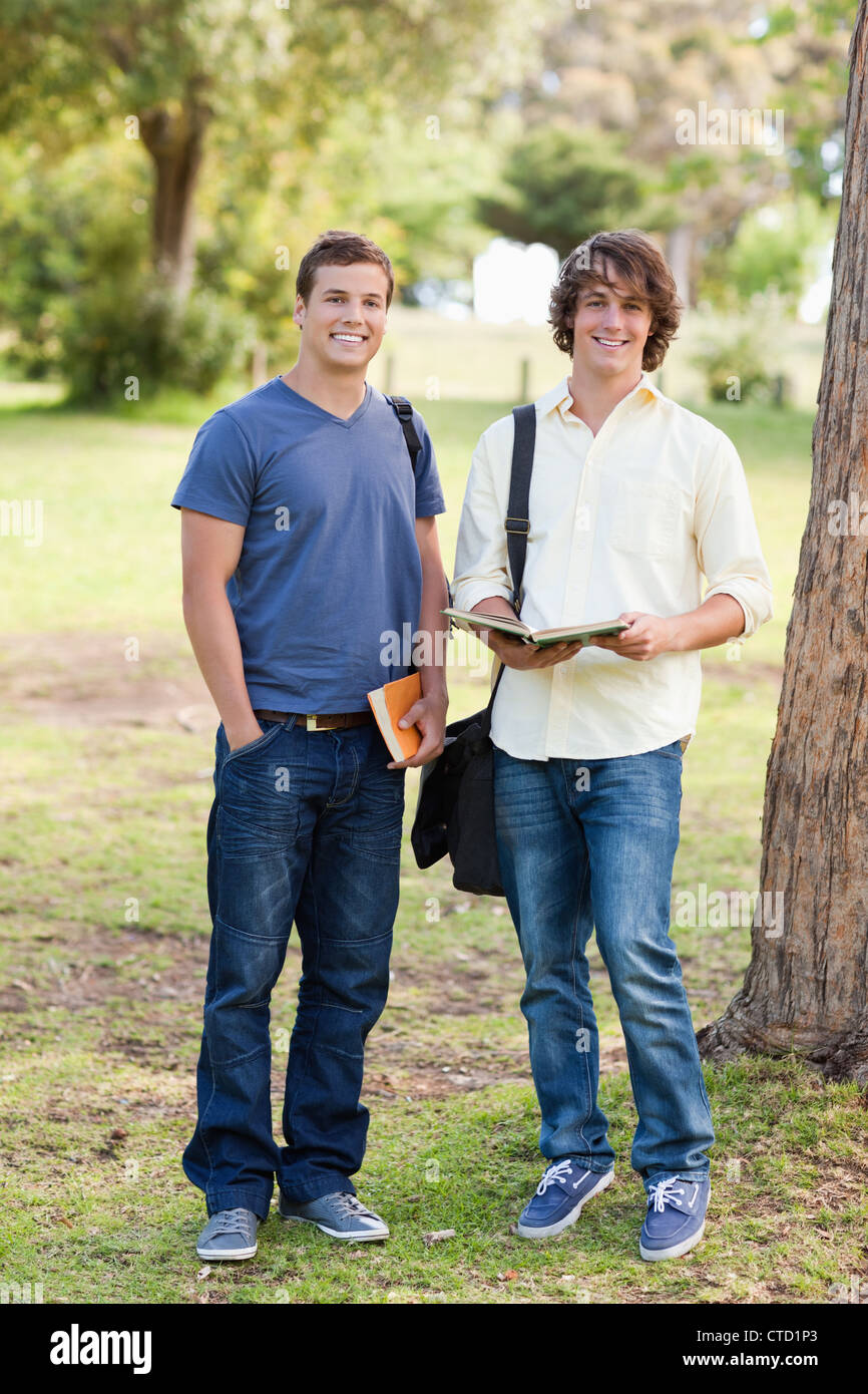 Portrait of two smiling male students posing Stock Photo - Alamy