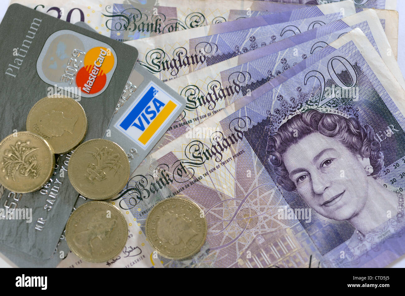 20 pound notes and one pound coins with credit card Stock Photo Alamy