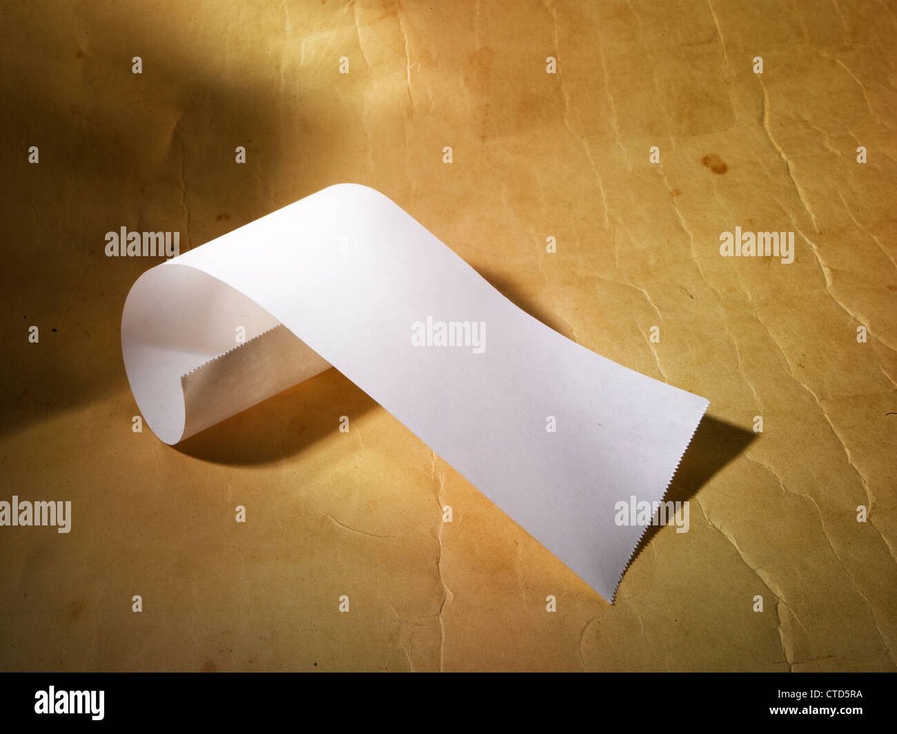 Receipt or an empty transaction journal on a yellow surface. Stock Photo