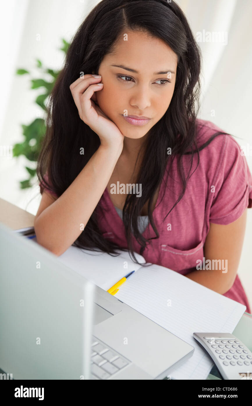Bored brunette student Stock Photo - Alamy