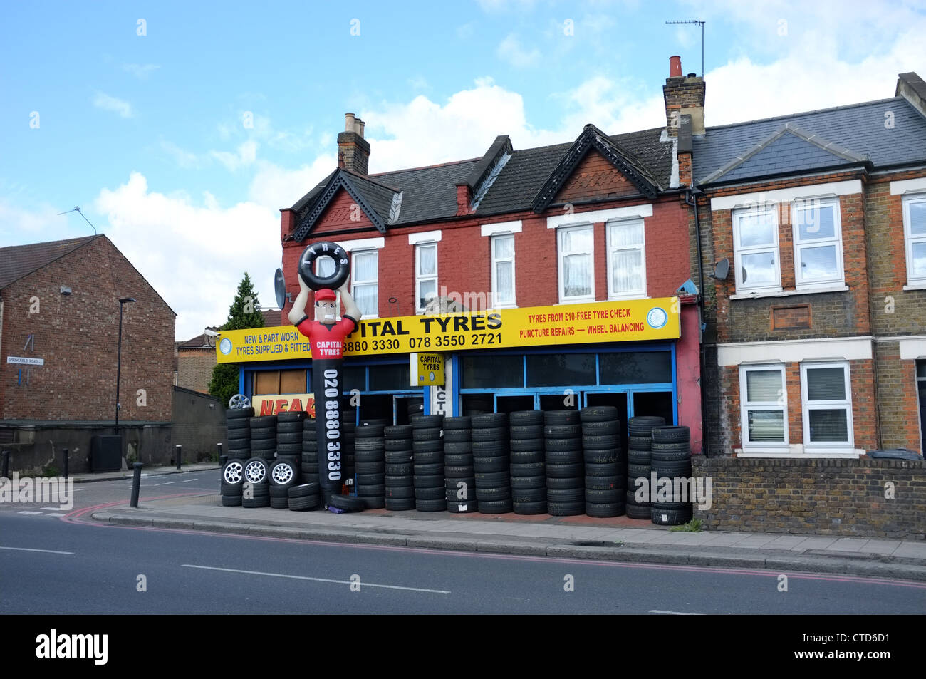 Car tyres and wheels for sale at Capital Tyres 173 Broad Lane London N15 4QT UK Stock Photo