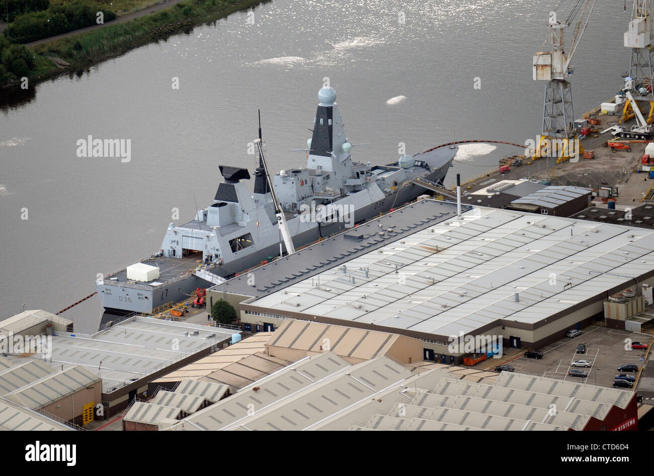 BAE Systems, Glasgow on the River Clyde, with warship in dock. Stock Photo