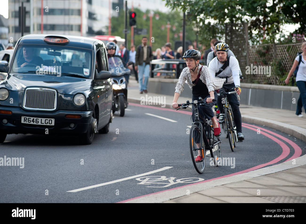 Cyclists cycling on a busy street in London, England Stock Photo Alamy