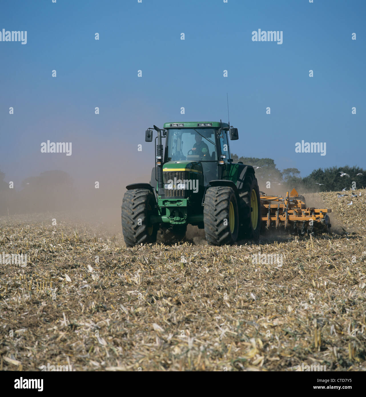 John Deere tractor disc harrowing maize stubble Stock Photo - Alamy