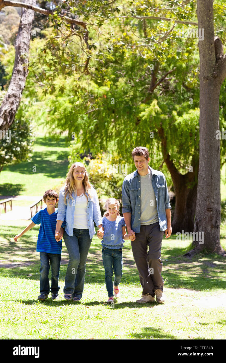 A happy family walking in the park Stock Photo - Alamy