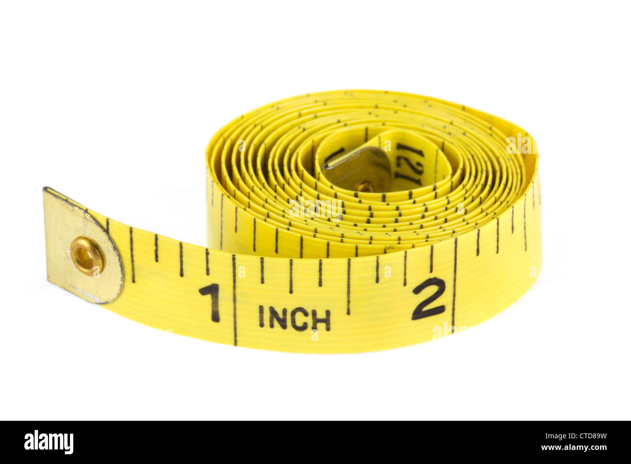 Yellow coiled tape measure on a white background Stock Photo