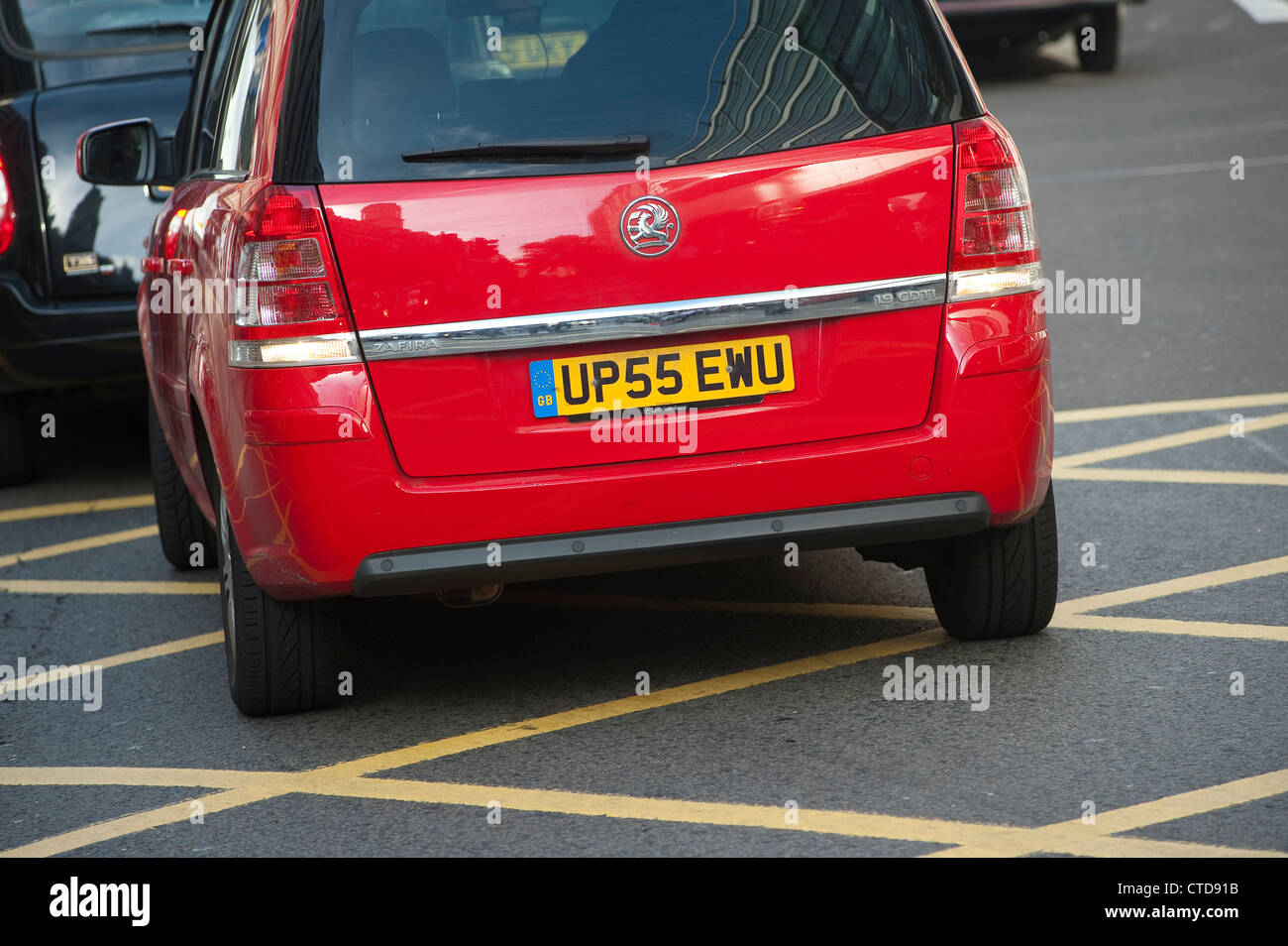 Close up of the rear of a car waiting in a yellow box junction in traffic, London, England. Stock Photo