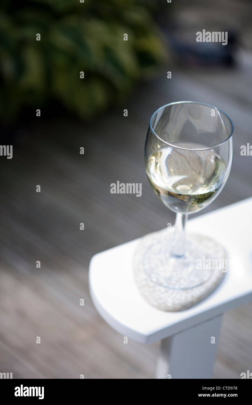 Shallow focus image of white wine in a garden Stock Photo