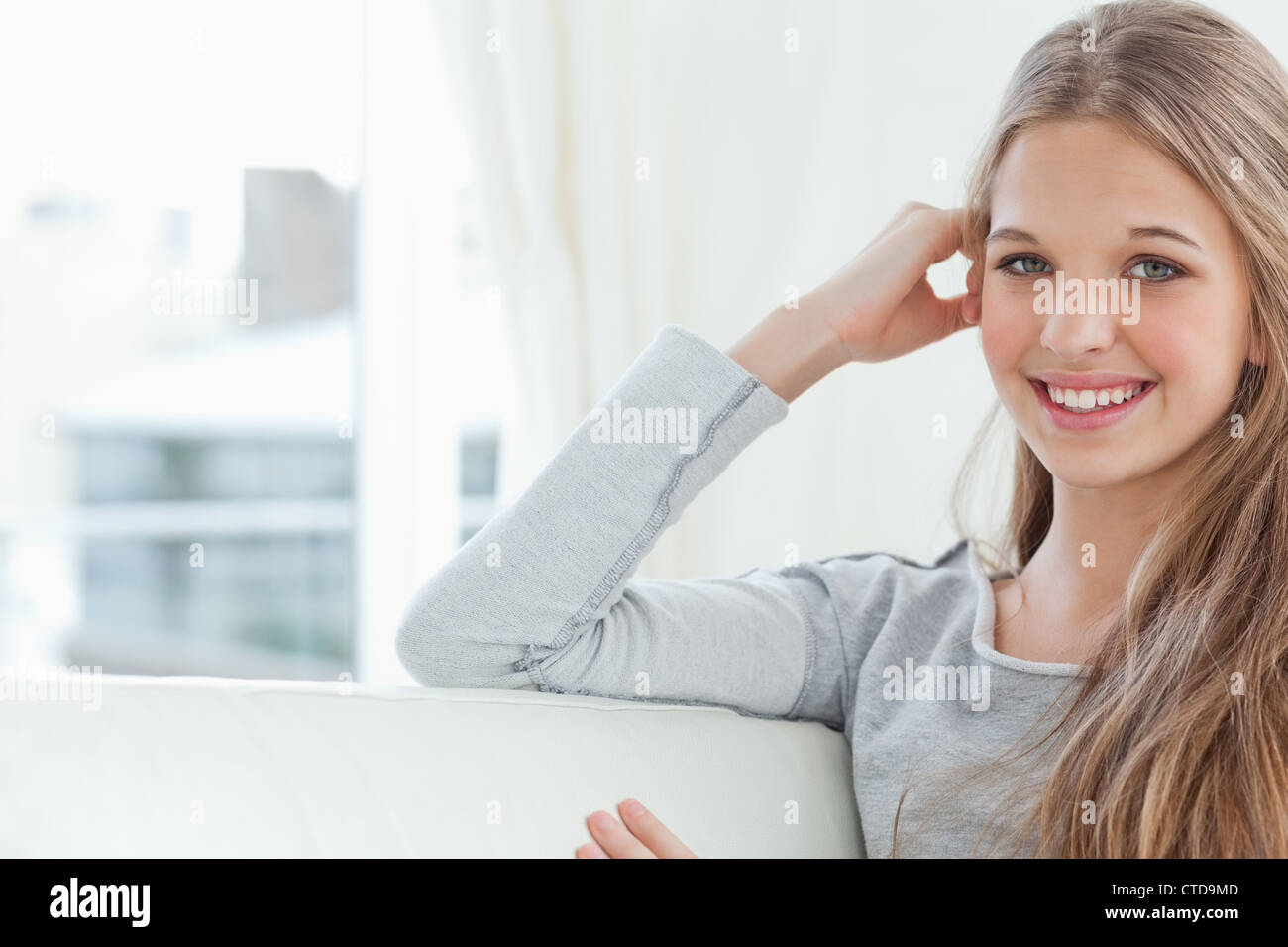 A smiling girl looking at the camera Stock Photo - Alamy