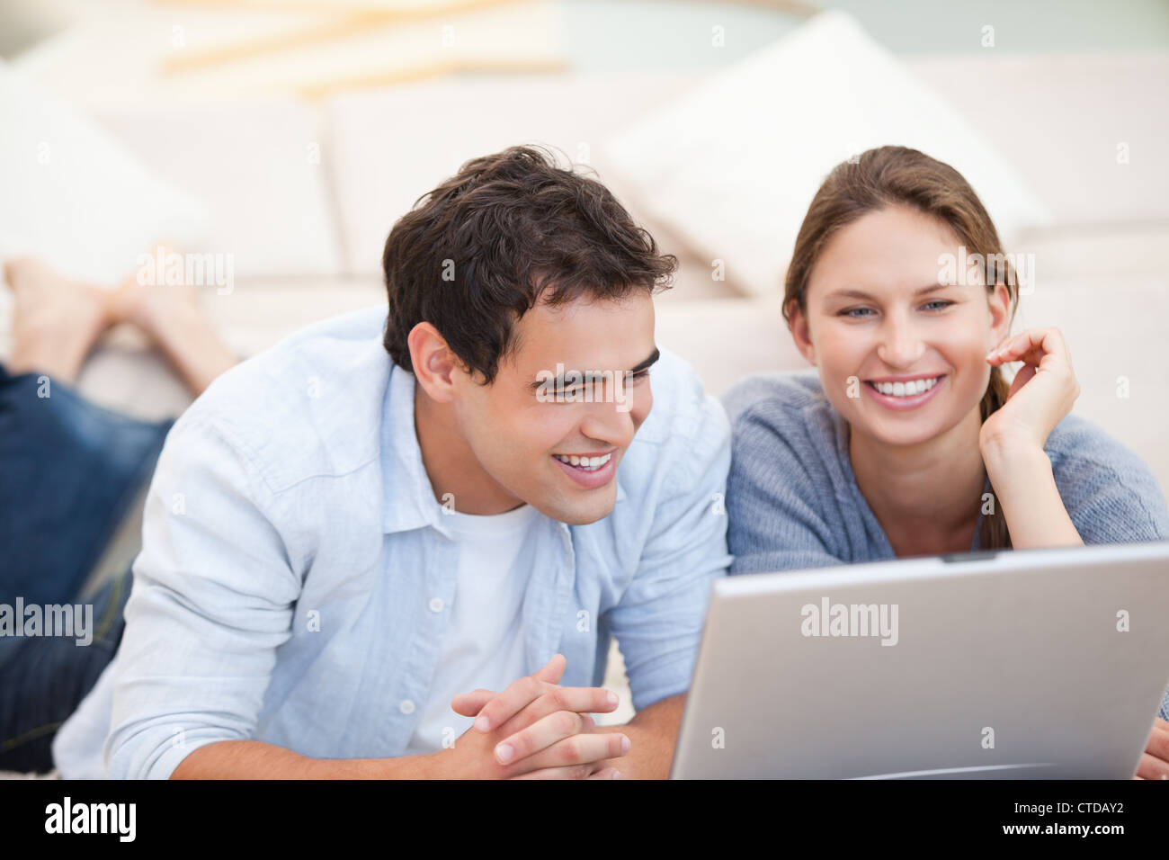 Watching Over Computer Young Couple watching a computer Stock Photo - Alamy