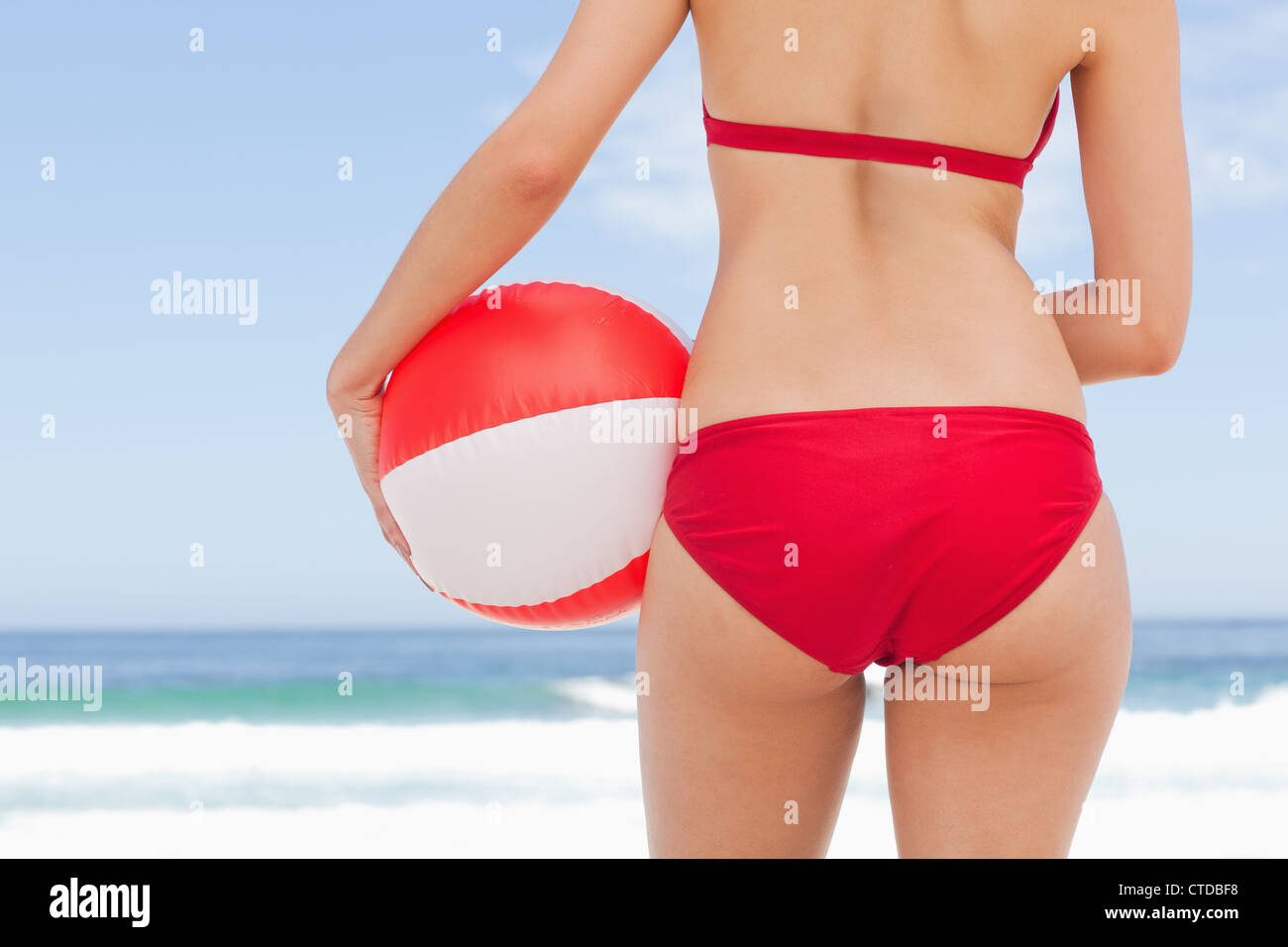 Woman holding beach ball against hi-res stock photography and images - Alamy