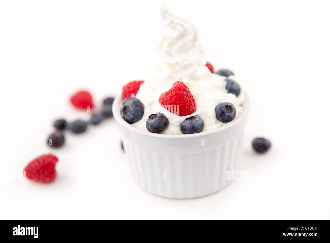 Dessert of berries and whipped cream Stock Photo Alamy