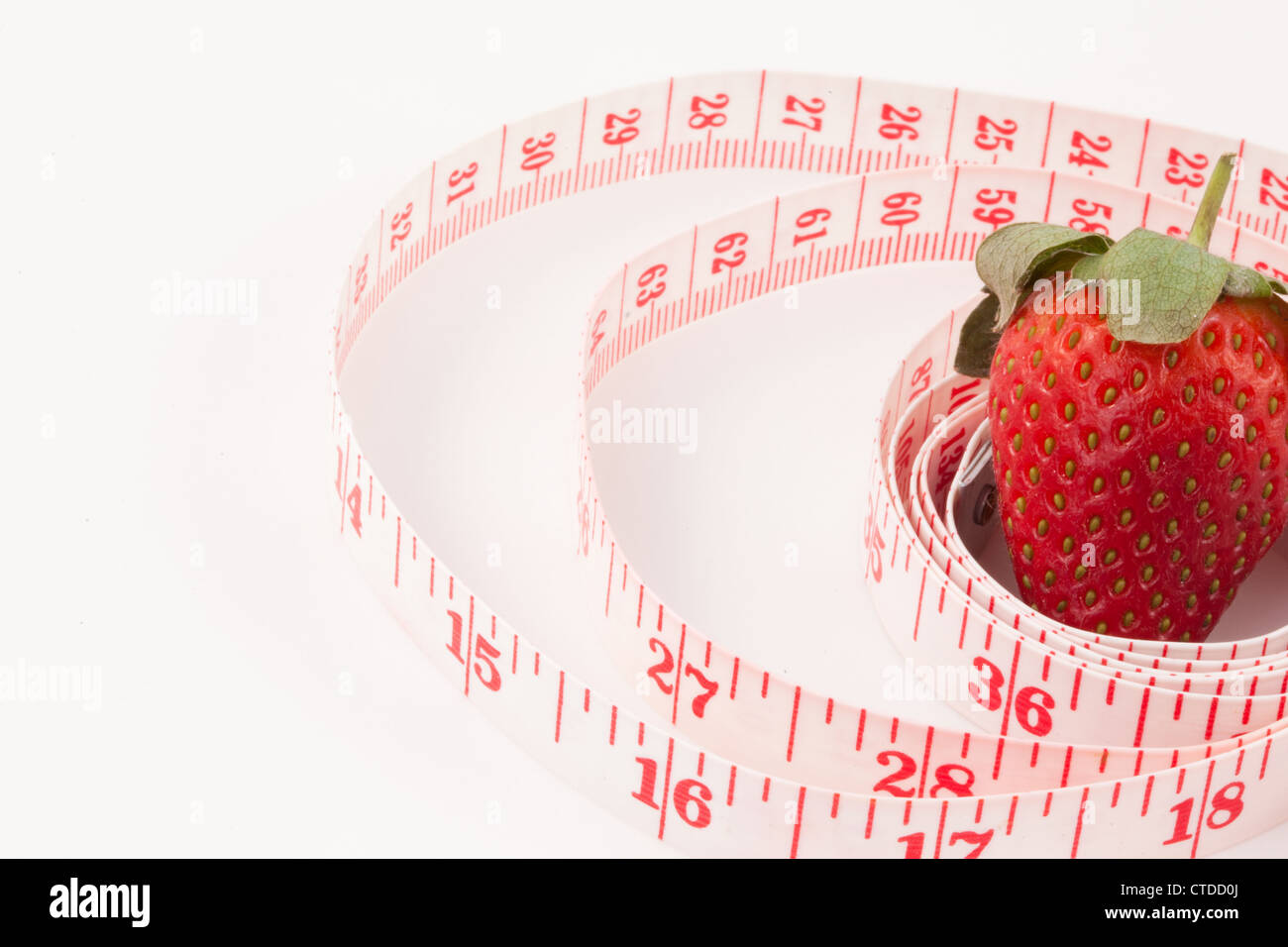 Close up of a strawberry surrounded by a ruler Stock Photo - Alamy