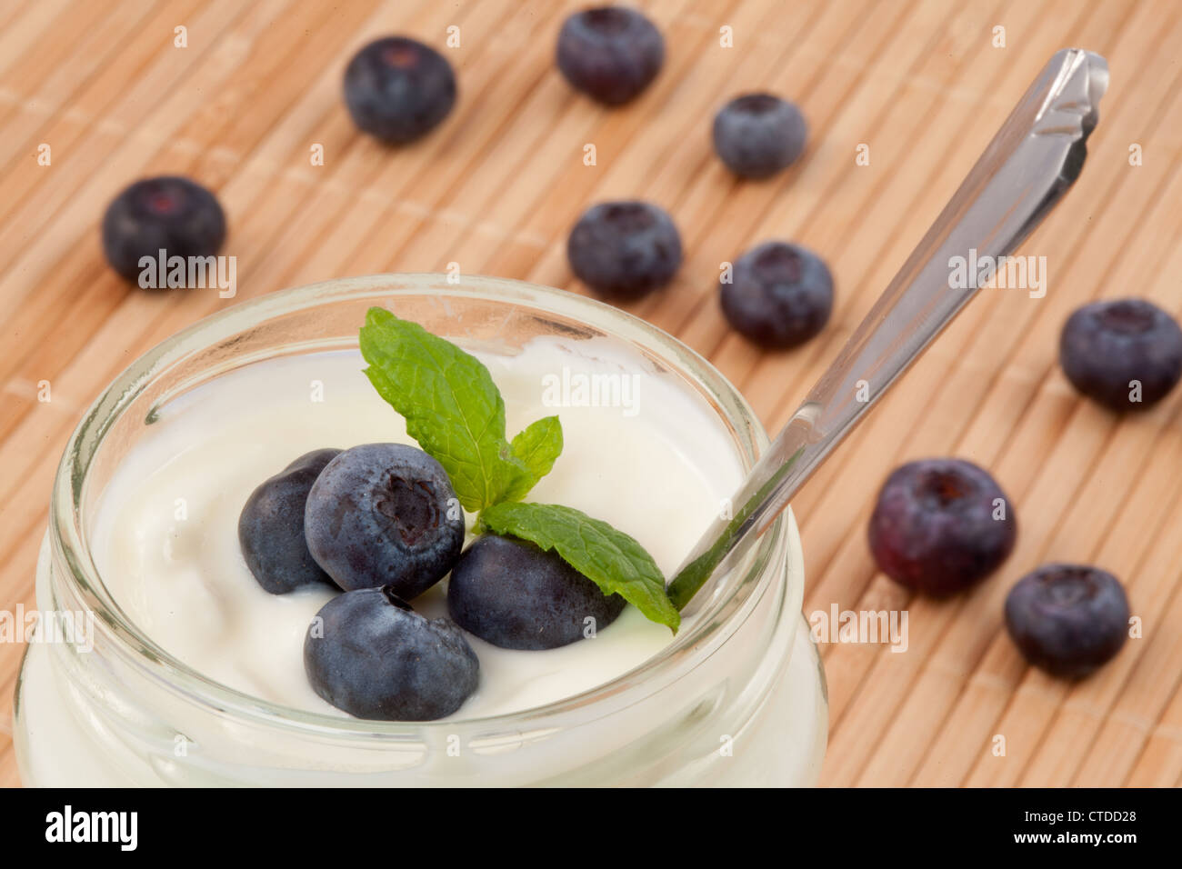 Close up of many blueberries in a pot of yogurt Stock Photo