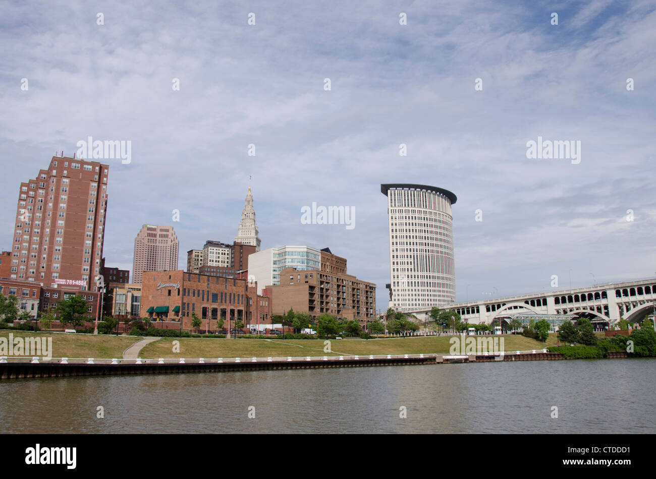 Ohio, Cleveland. Cuyahoga River waterfront with city skyline Stock