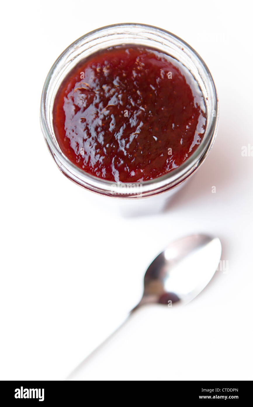 Jar of jam and spoon Stock Photo Alamy