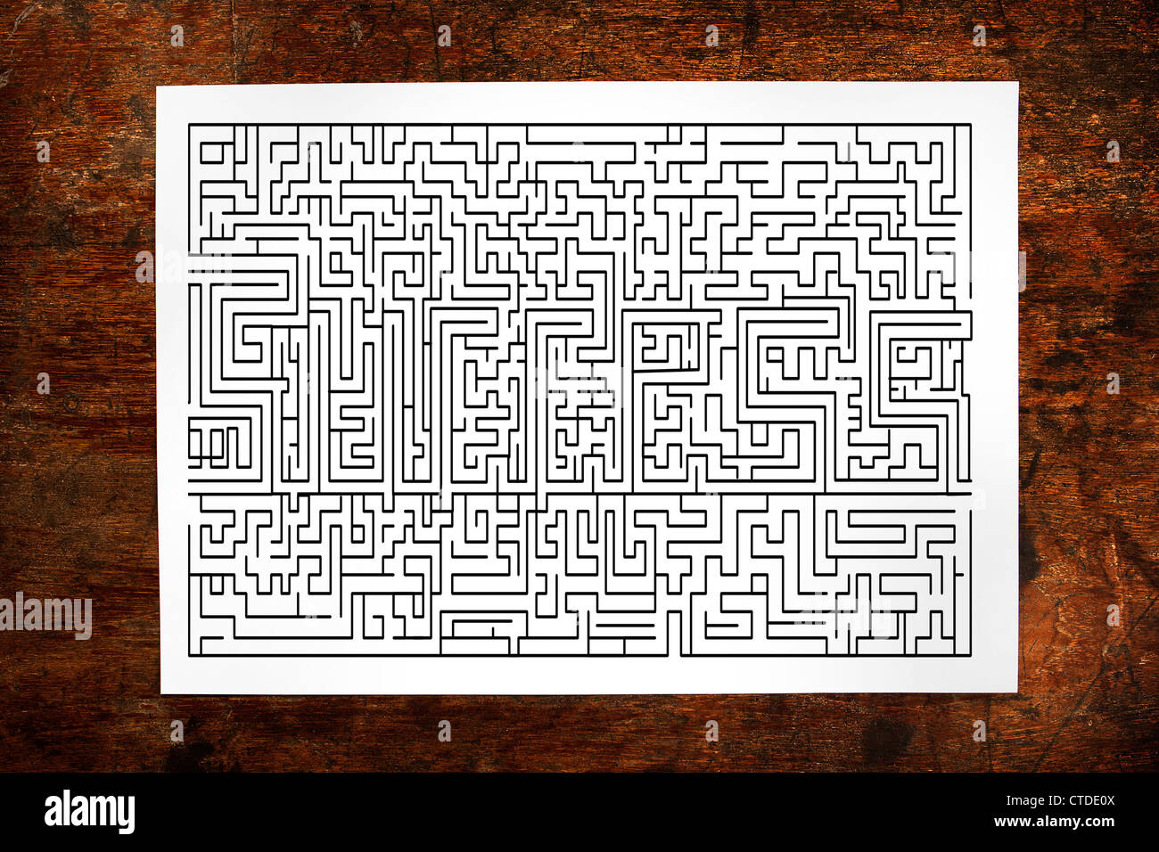 Channel maze game on wood background Stock Photo