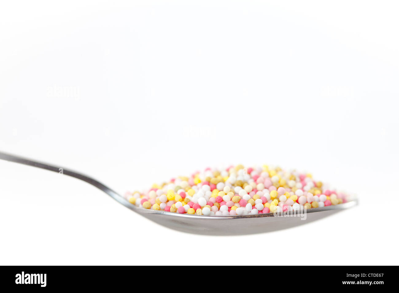 Sprinkles in a spoon Stock Photo Alamy