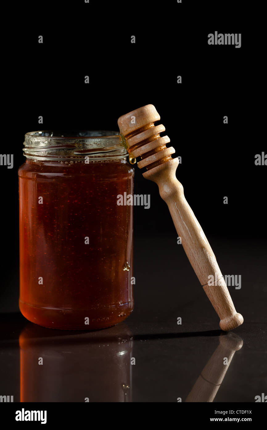Honey jar and honey dipper Stock Photo Alamy