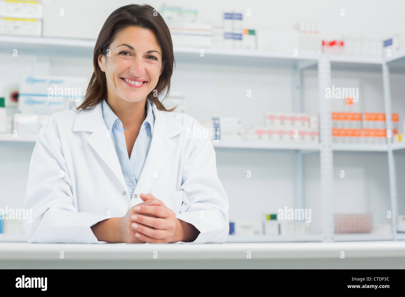 Pharmacist behind counter hi-res stock photography and images - Alamy