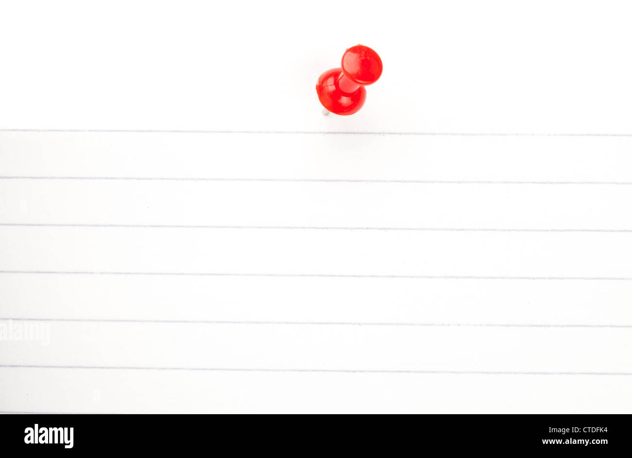 Red pushpin with a white paper Stock Photo