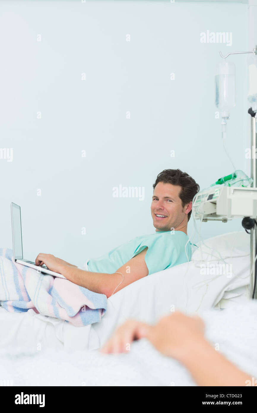 Hospital bed laptop typing hi-res stock photography and images - Alamy