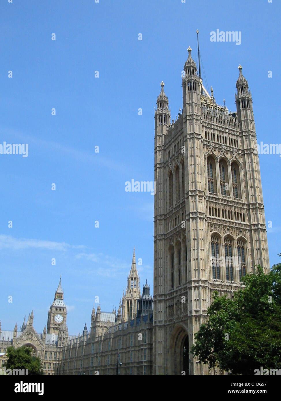 The Elizabeth Tower in the background housing Big Ben and the Victoria Tower in the foreground at the Palace of Westminster Stock Photo