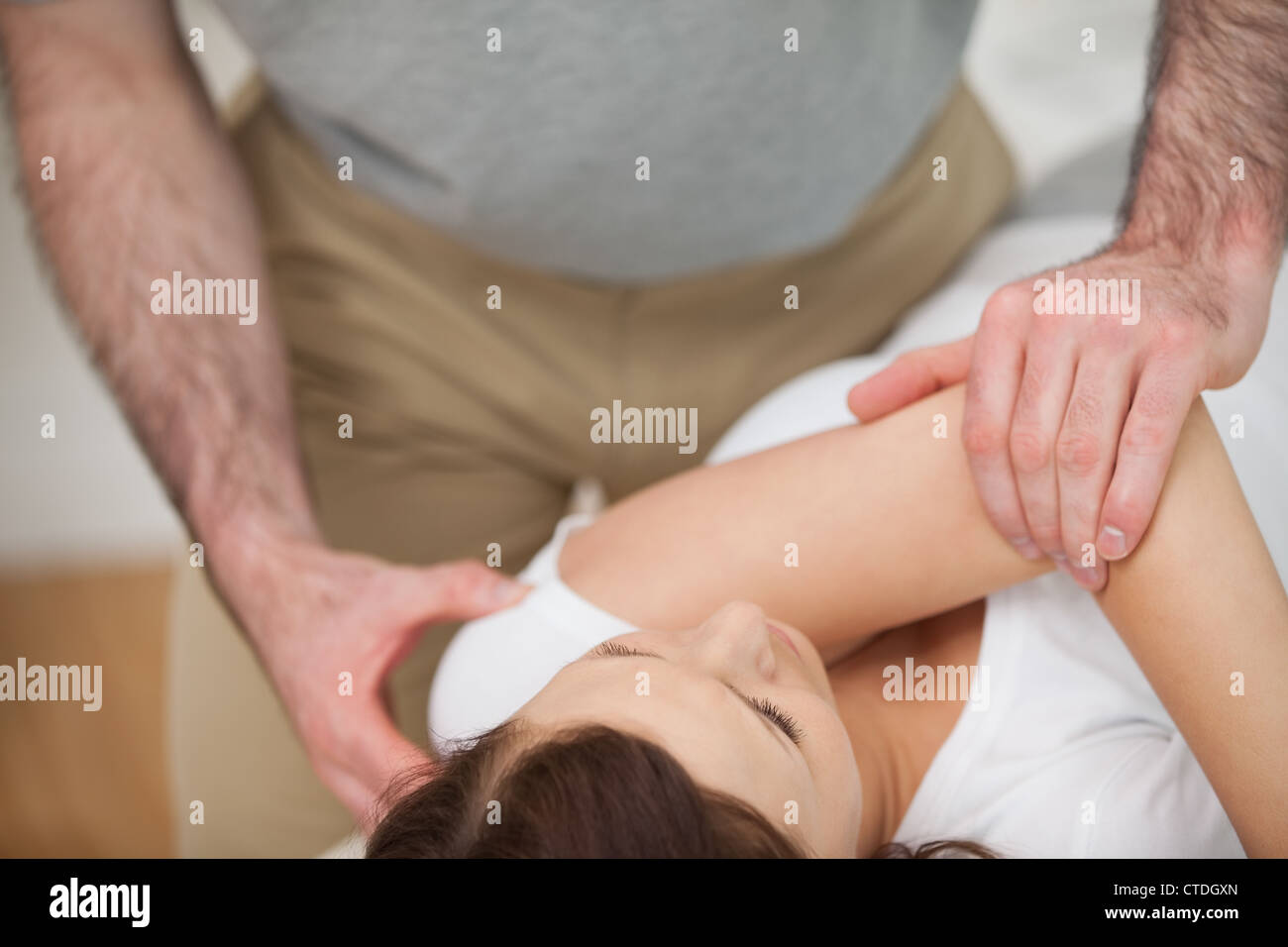 Osteopath making a joint mobilisation Stock Photo