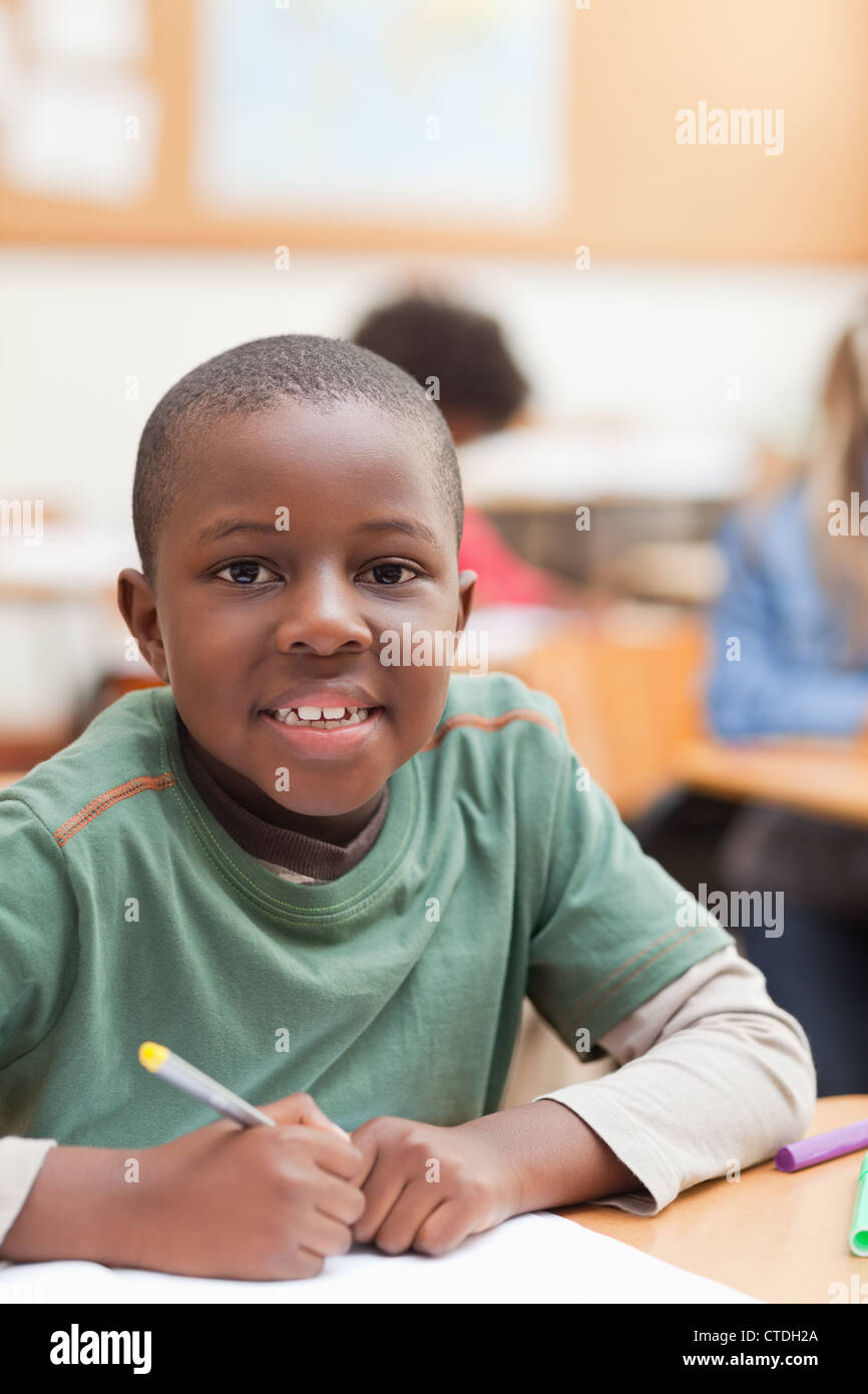 Student sitting at his desk Stock Photo