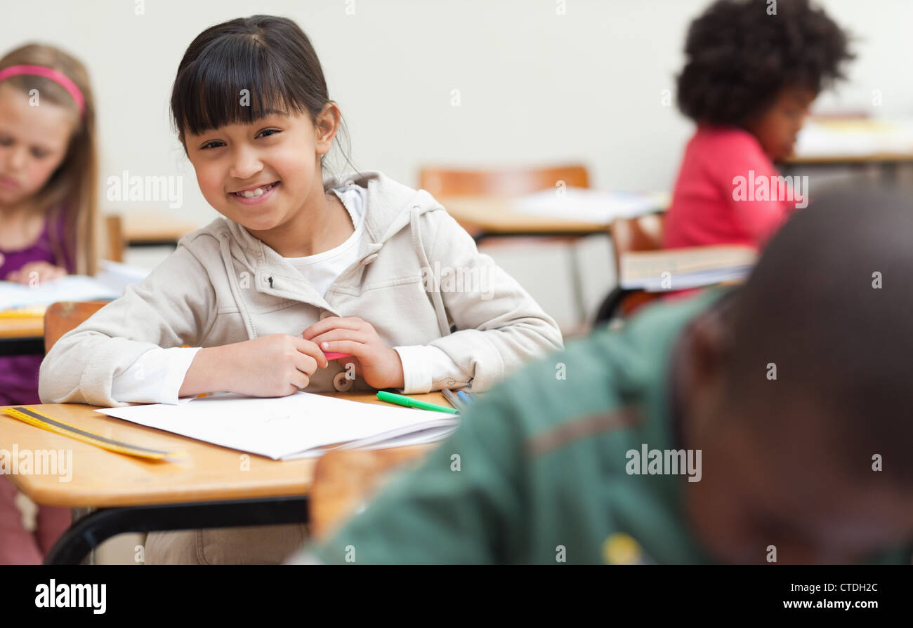 Schoolgirl sitting at her desk Stock Photo - Alamy