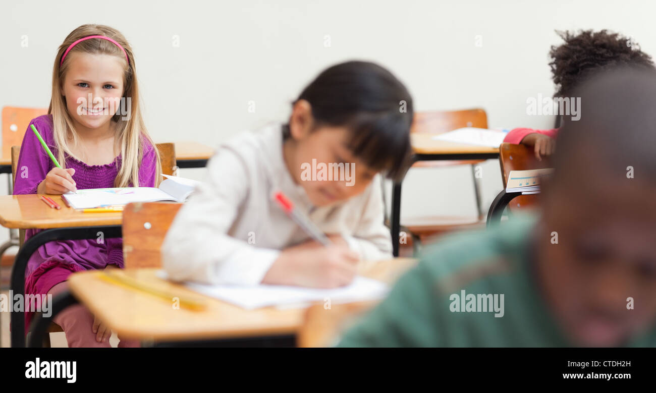 Little girl sitting in class Stock Photo - Alamy