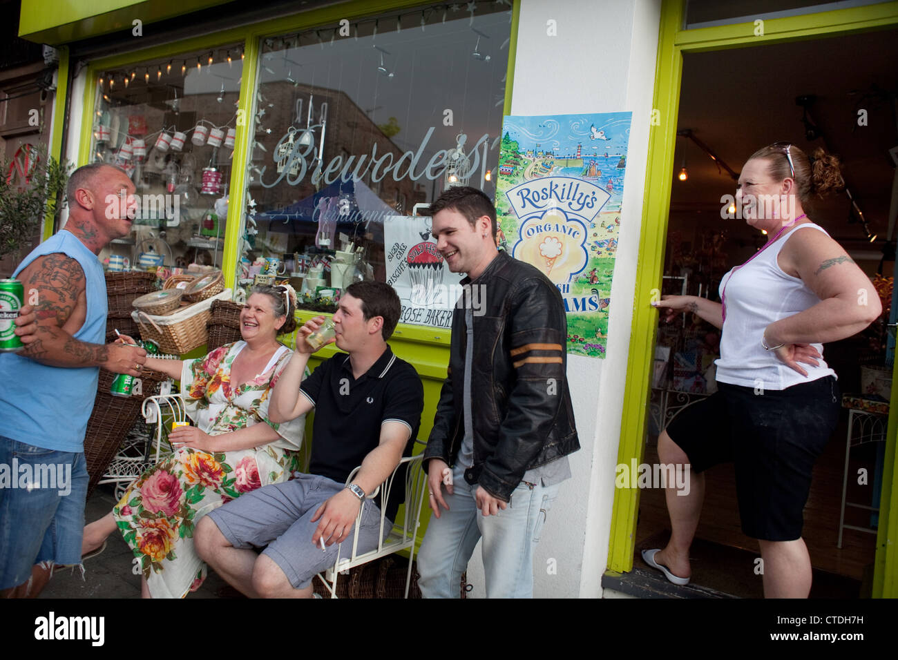 Shop keeper Louise Brewood and friends outside her shop Brewood's Cornucopia. Stock Photo