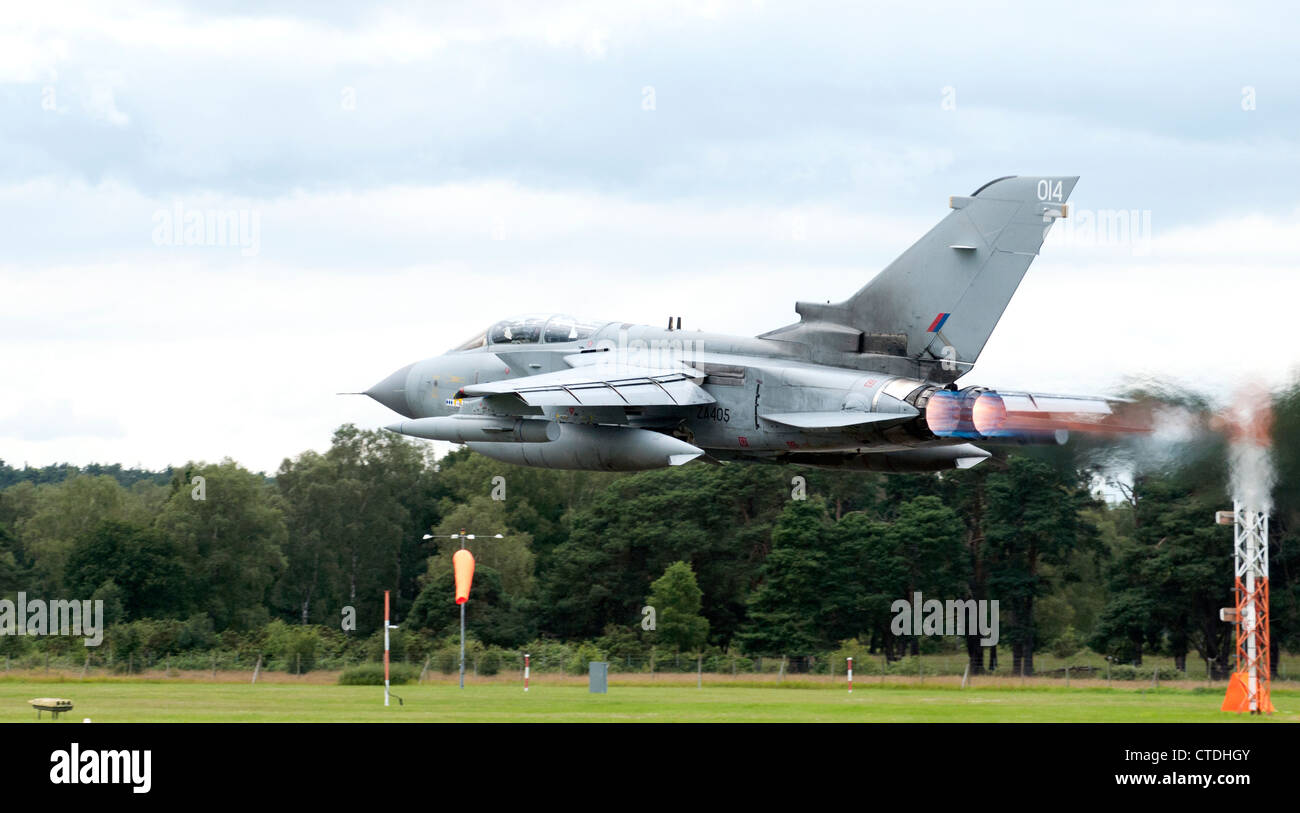 RAF Tornado jet flying very low with afterburners on Stock Photo
