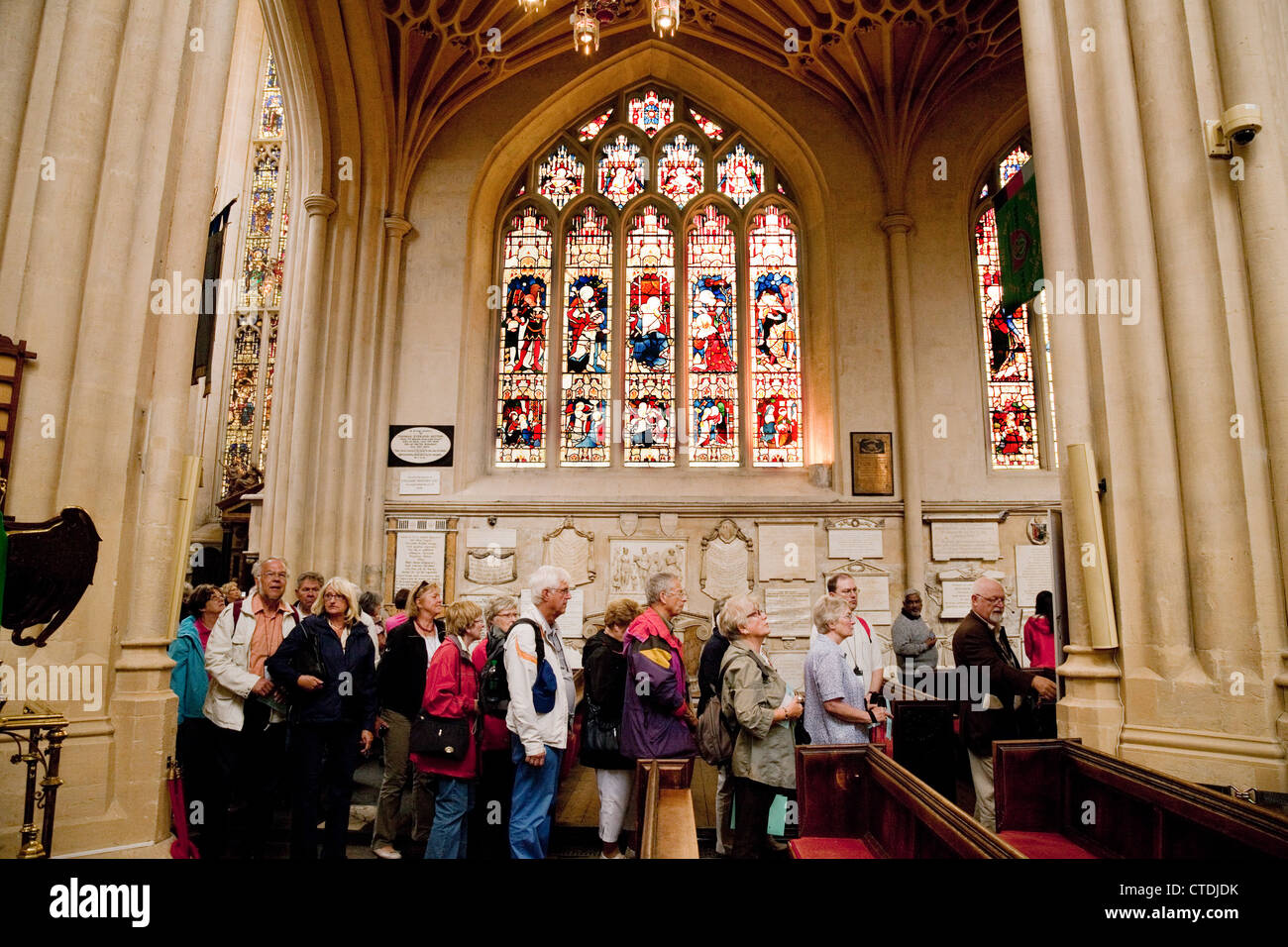 Tourists in Bath Abbey interior, Bath, Somerset UK Stock Photo