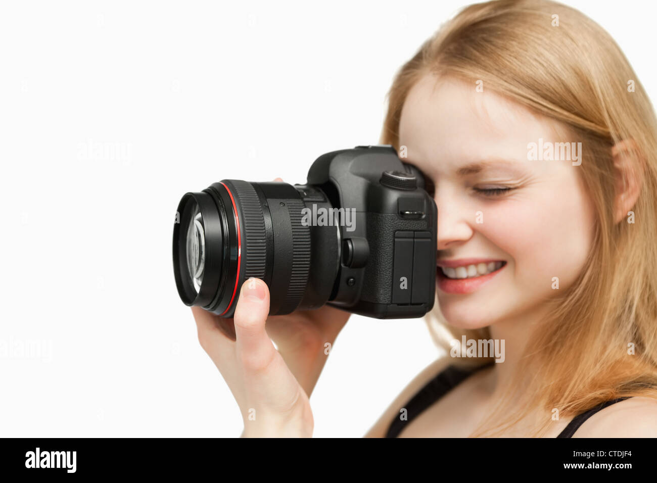Smiling woman holding a camera Stock Photo - Alamy