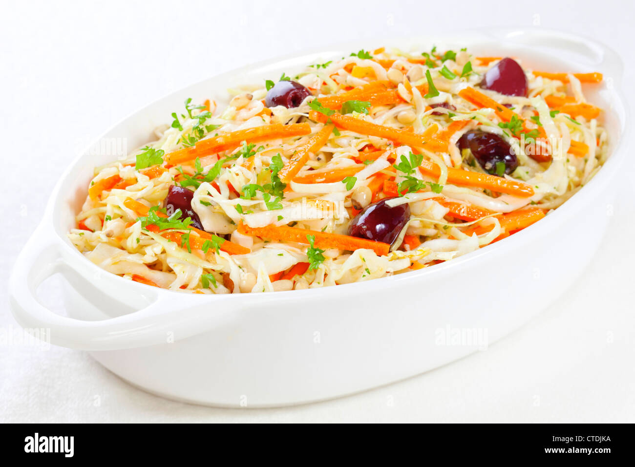 Greek style coleslaw in a lemon vinaigrette dressing, with olives and