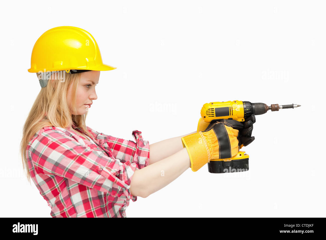 Serious woman using an electric screwdriver Stock Photo Alamy