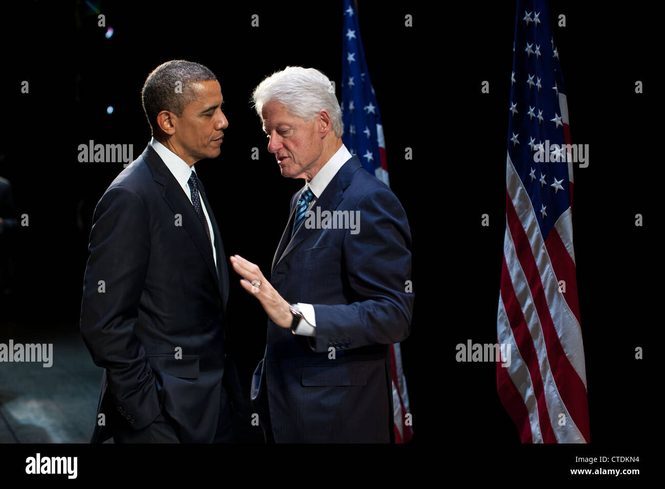 US President Barack Obama talks with former President Bill Clinton backstage at the New Amsterdam Theater June 4, 2012 in New York, NY. Stock Photo