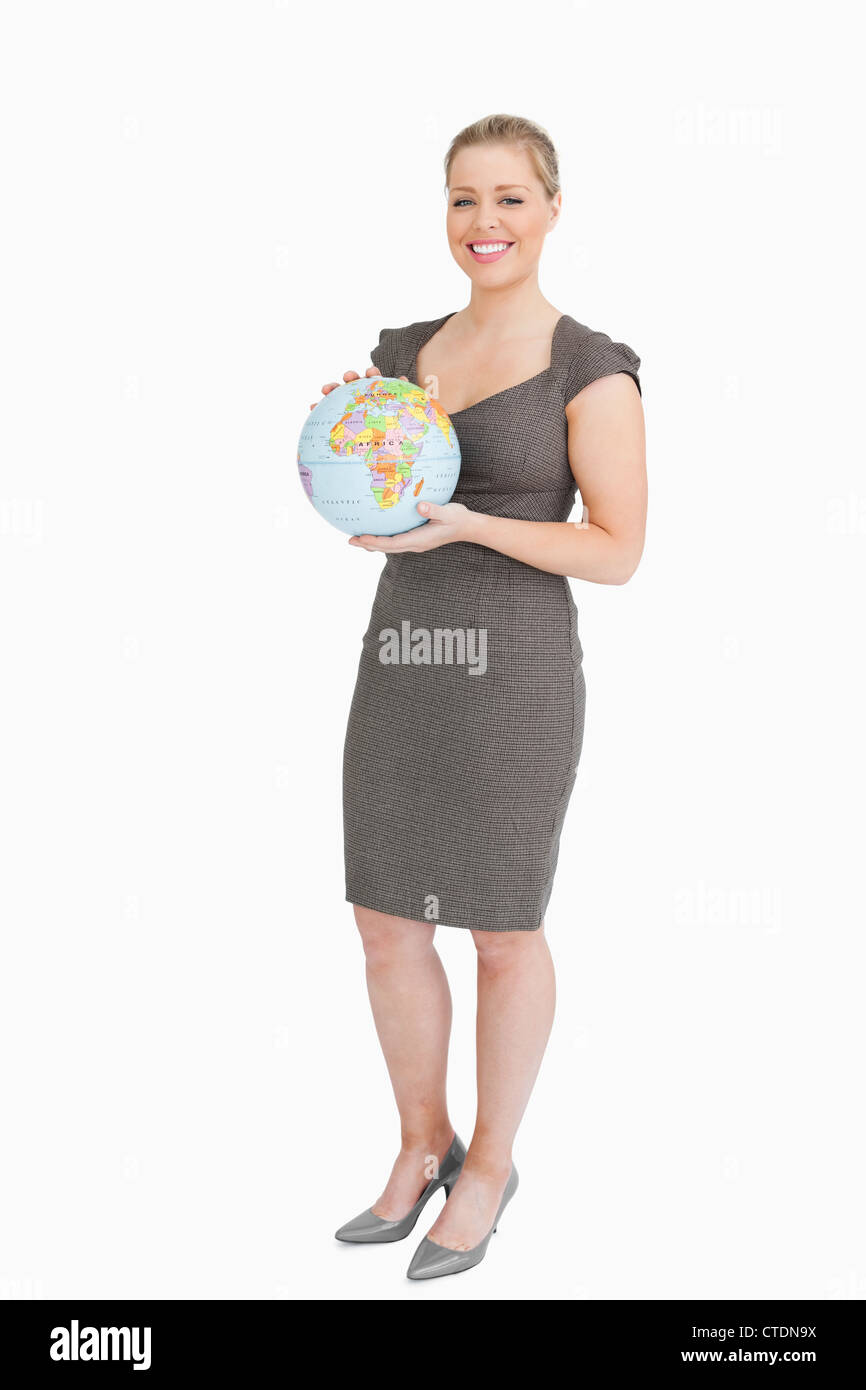 Businesswoman holding a globe in her hands Stock Photo