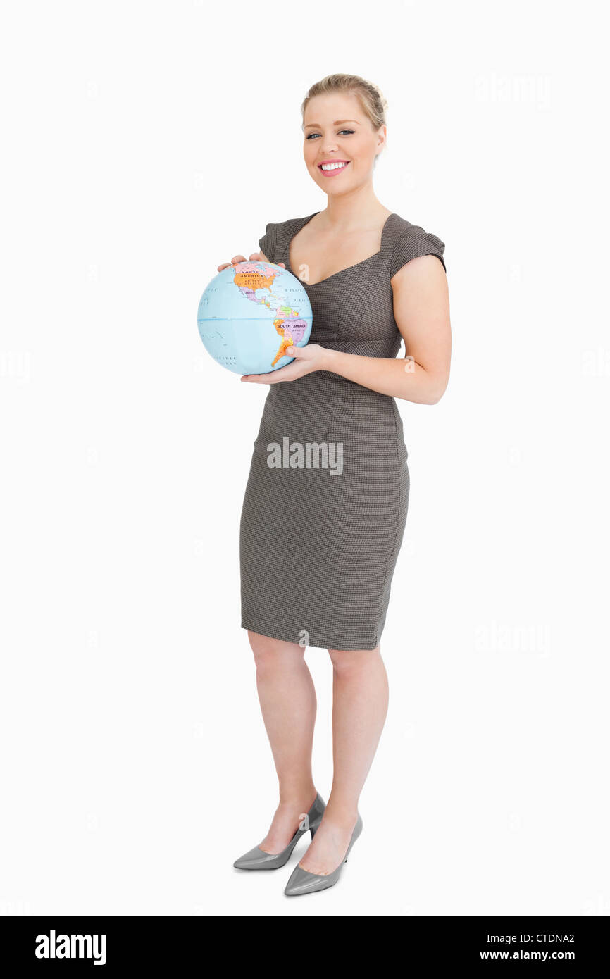 Businesswoman holding a globe Stock Photo