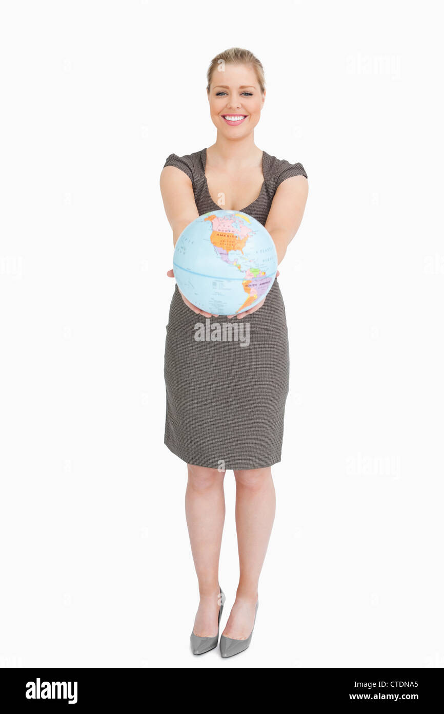 Businesswoman showing a globe Stock Photo