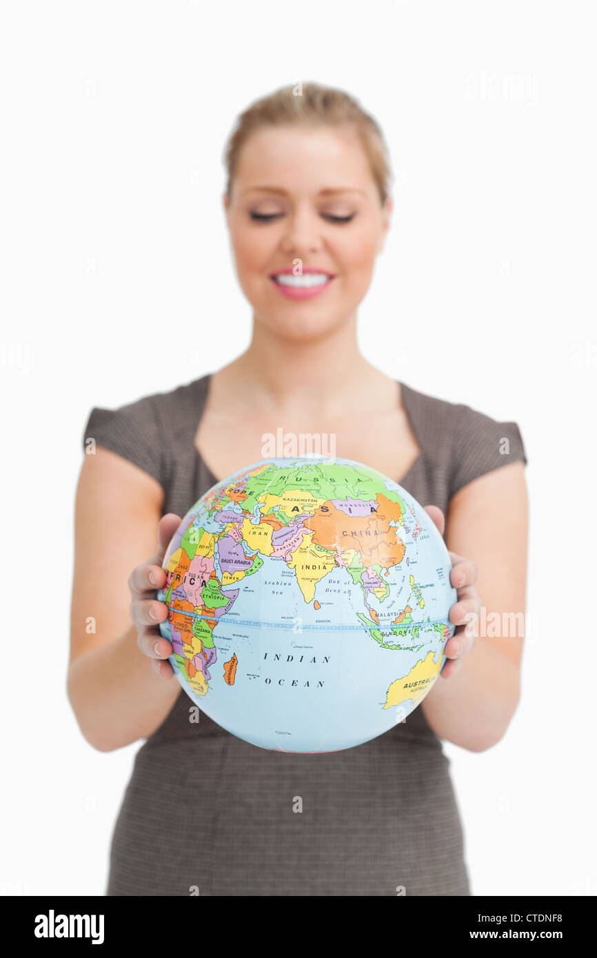 Woman looking a globe Stock Photo