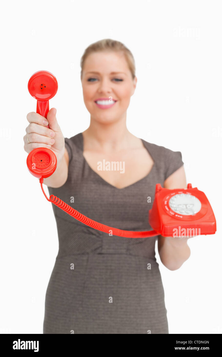Woman showing a retro phone Stock Photo