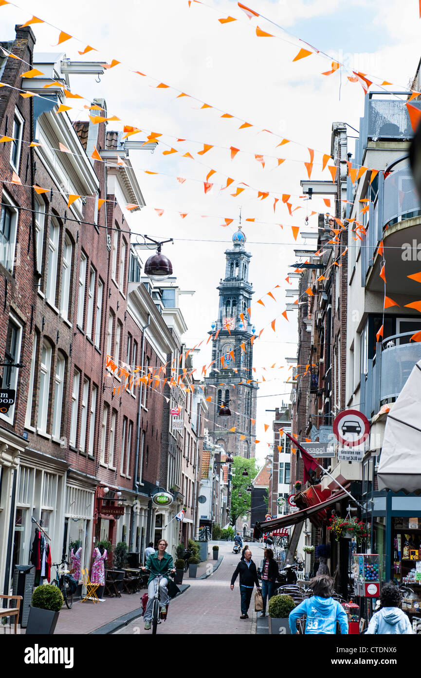 One of the main thorough fares in the Amsterdam Jordaan neighbourhood. Orange flags to support national soccer team. Stock Photo