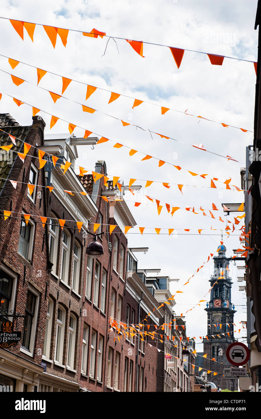 One of the main thorough fares in the Amsterdam Jordaan neighbourhood. Orange flags to support national soccer team. Stock Photo