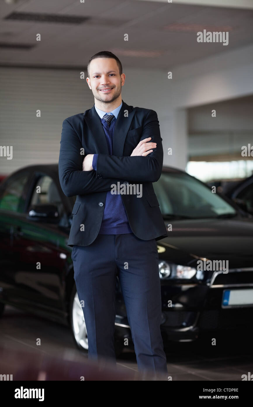 Salesman standing in front of car Stock Photo