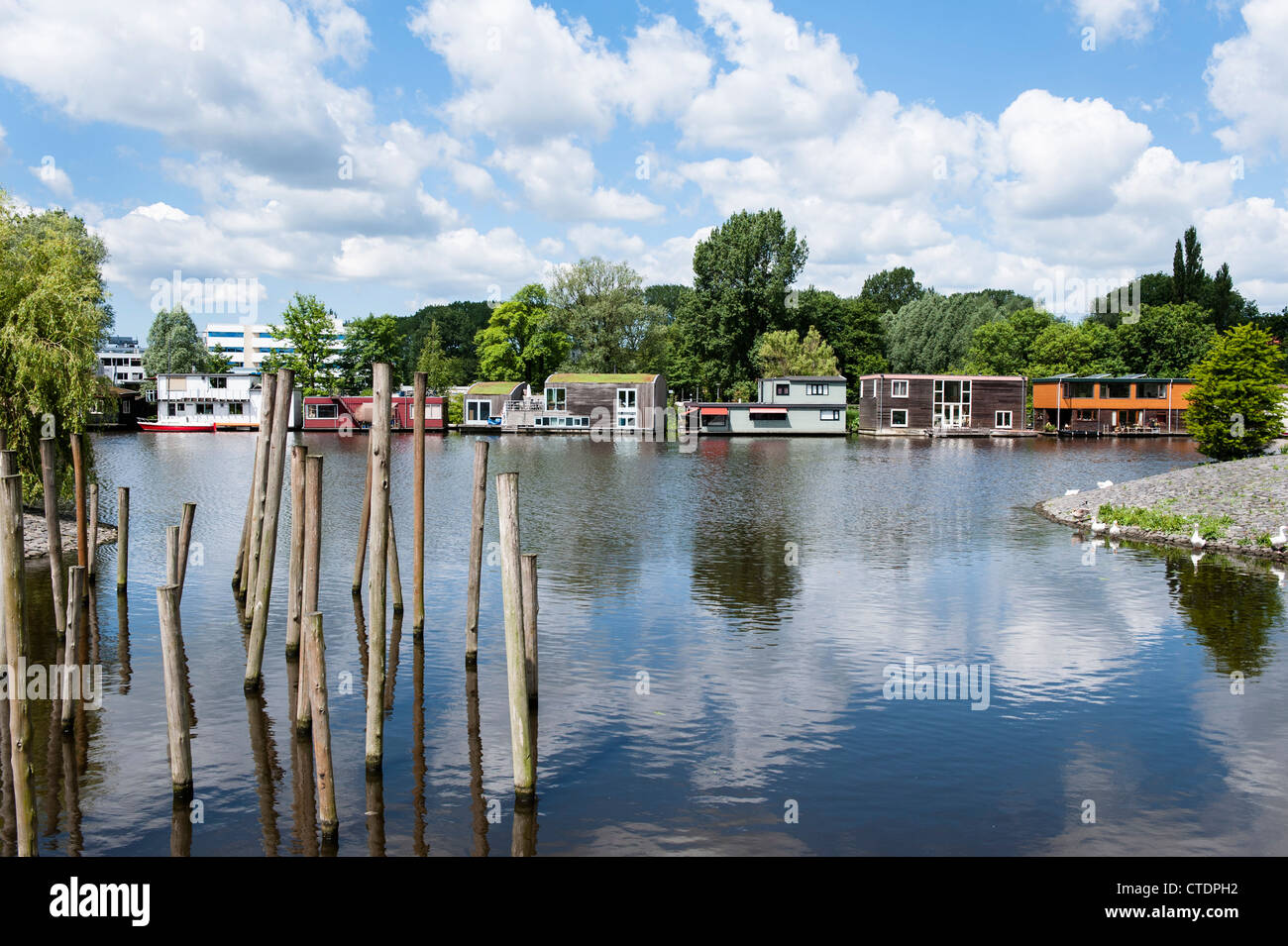 June 2012 Row of luxurious house boats along the Schinkel opposite the Olympic Stadium. Stock Photo